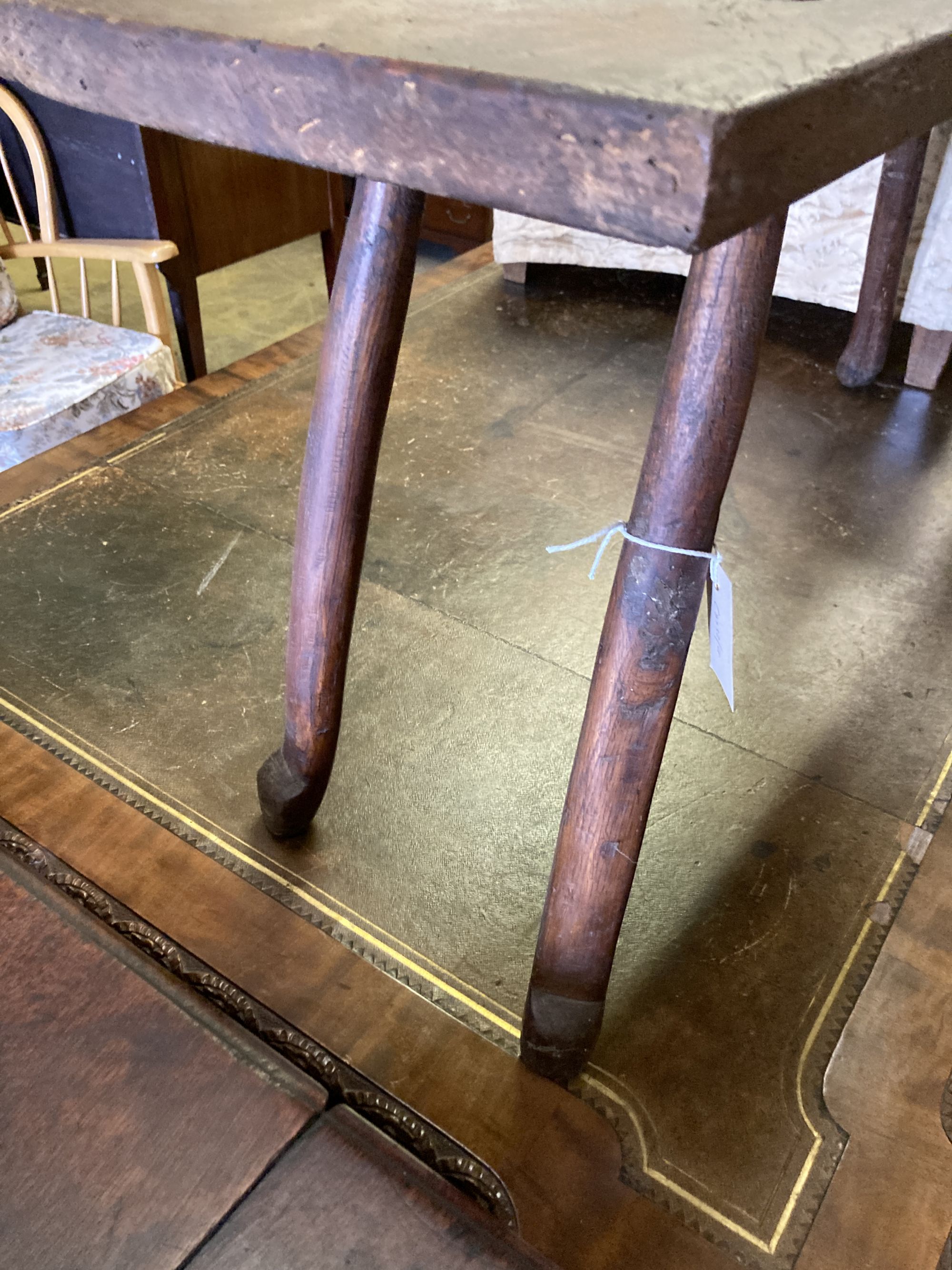 A small 19th century elm bench, on pegged legs, length 101cm, depth 30cm, height 49cm